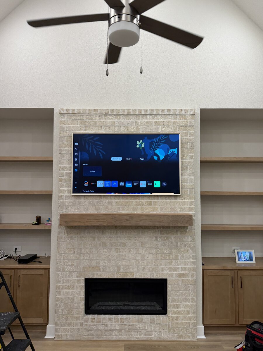 TV mounted above fireplace with concealed wires, Houston TX #1